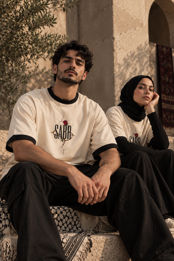 Two-model editorial portrait featuring WAQT SABR rose T-shirt