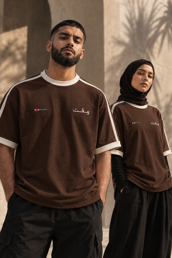 Streetwear portrait featuring WAQT Palestine T-shirt in walnut brown